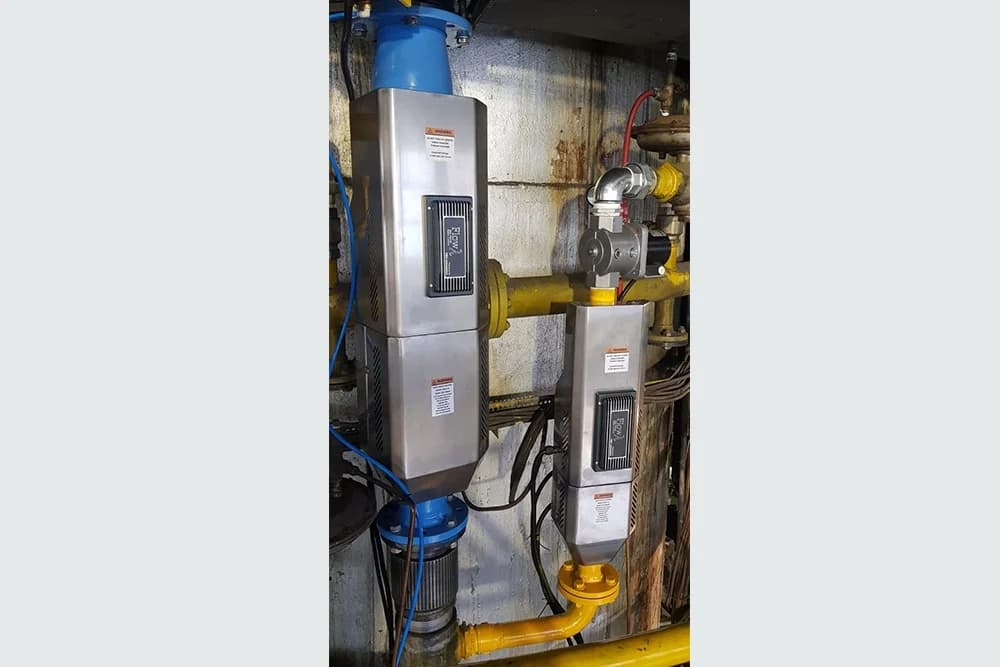 Pneumatic loading units installed on an industrial pipe network.